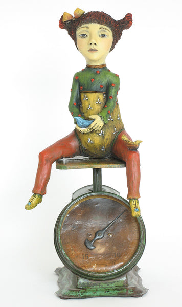 SOLD  "Weighing Her Options" original ceramic sculpture with antique scale" by Jacquline Hurlbert